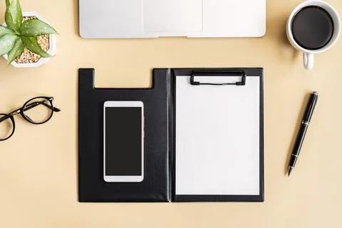 Empty screen Smart phone and file folder on business desk office with copy .. 스톡 사진