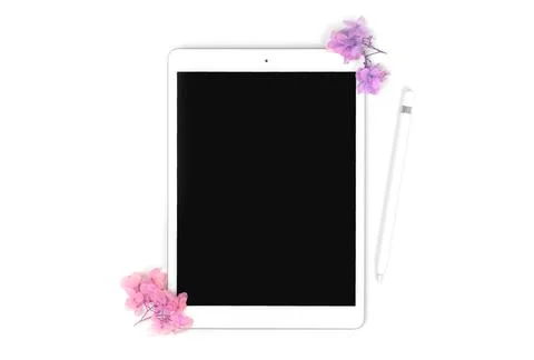 Empty screen tablet computer mock-up with floral dried flowers and pencil sty Stock Photos