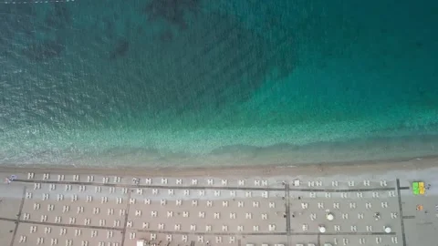 Empty sea beach with sun beds and umbrellas. Stock Footage 246391214