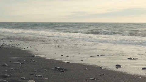 Empty seacoast in cloudy weather, waves are splashing in evening time Stock Footage 86201287