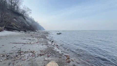 Empty Seashore Under Pale Sky Concept of Solitude and Infinity Video stock 320950309