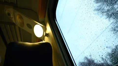 Empty seat and train window on rainy day Stock Footage 108799263
