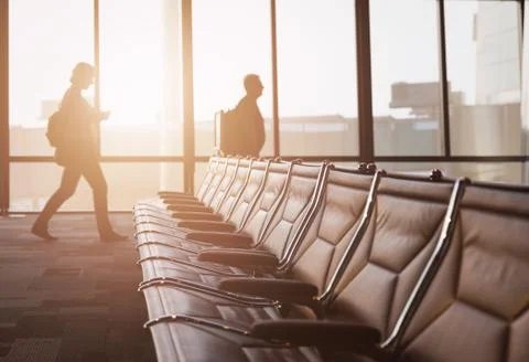 Empty seat with walking passengers to flight Stock Photos