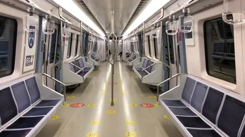 Empty seats and corridor of a subway at the station during covid quarantine Stock Footage 145386564