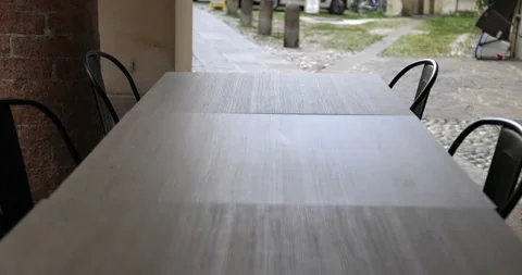 Empty seats and table of a cafeteria during pandemic covid 19 in an italian city Stock Footage 150155524