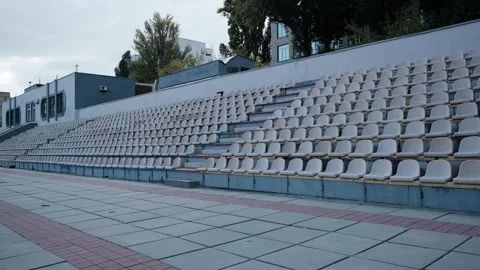 Empty seats in the old stadium in autumn Stock Footage 163920841