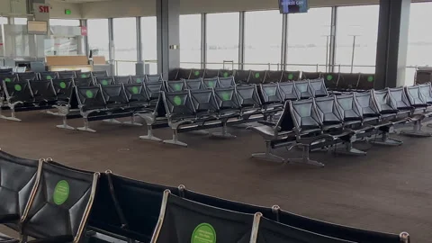 Empty seats at a passenger waiting gate due to the Covid 19, SeaTac airport. Stock Footage 145438552