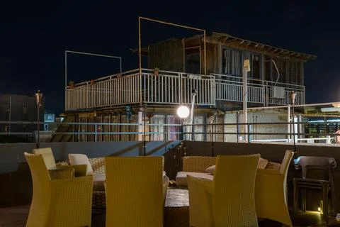 Empty Seats at the Round Table at  Night Stock Photos