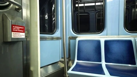 Empty seats on subway at night as train travels underground Vidéo 119297609