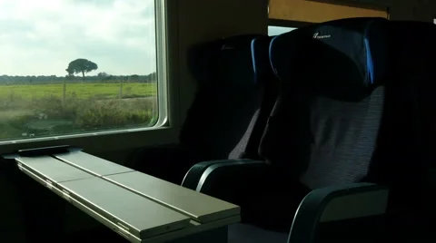 Empty seats on train going fast in the Italian countryside Stock Footage 58843140