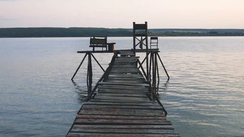 Empty self-made fishing platform on a lake. A place to relax. Stock Footage 118084769