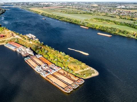 Empty self-propelled barges stand at the pier Stock Photos