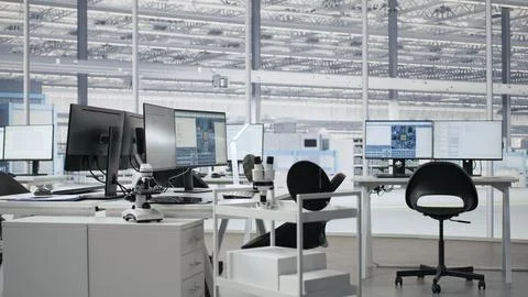 Empty semiconductor engineering office with computers Stock Photos