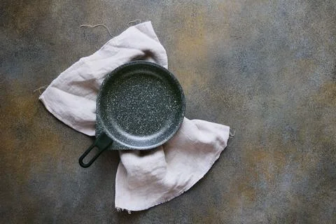 Empty serving pan on linen napkin, abstract background with space for text, t Stock Photos