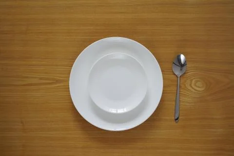 Empty set of plates from top view with spoon Stock Photos