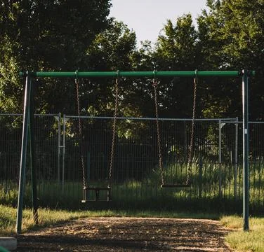 Empty set of swings Stock Photos