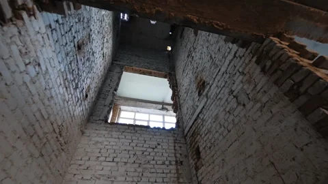 Empty shaft of an old elevator built of shabby dirty bricks. Stock Footage 292933872