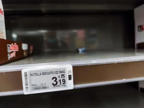 Empty shelf of B-ready nutella biscuit with focus are its shelf label showing Stock Photos