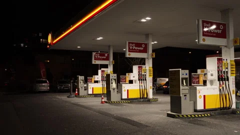 Empty Shell Gas Station at Night with Fuel Pumps and Lights in Budapest, Hungary Stock Footage 320244835