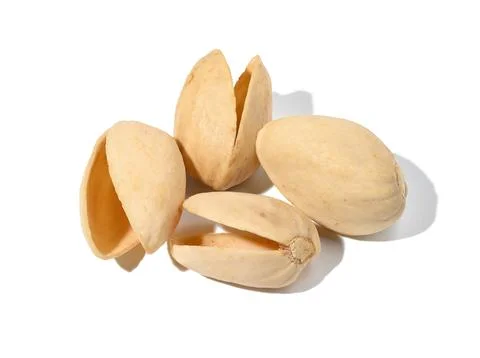 Empty shell of roasted pistachios on a white isolated background Stock Photos