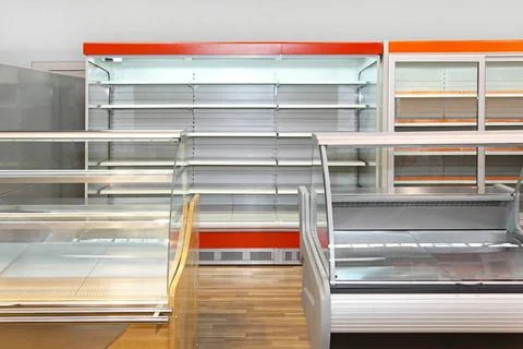 Empty shelves Empty retail shelves and showcases in grocery store Copyrigh... Stock Photos