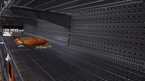 Empty shelves in the store. Food was sold out in the face of panic and crisis. Stock Footage 128972542
