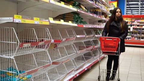 Empty shelves in store. Supermarket with empty shelves for goods. Panic from the Stock Footage 127044774