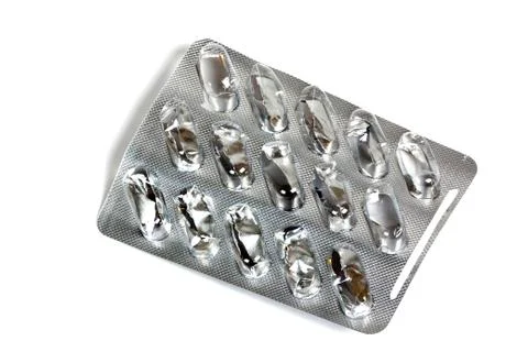 Empty Shiny Blister Pack with Capsules Popped Out Stock Photos