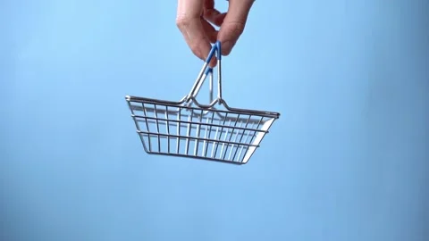 Empty shopping cart on blue background, finance and shopping Stock Footage 172026919