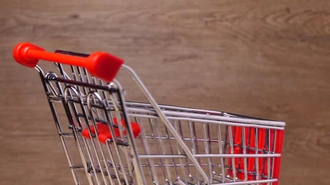 Empty shopping cart rotates on a board Video stock 248310318