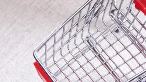 Empty shopping cart rotating on a board Stock Footage 249696770