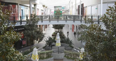Empty Shopping Mall With Only Two Shoppers Stock Footage 129349656
