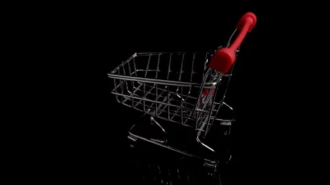 Empty shopping trolley supermarket basket, shopping cart on black background Stock Footage 226830689