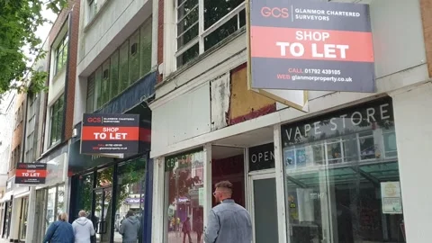 Empty shops in city centre with To Let signs and people Stock Footage 234977623