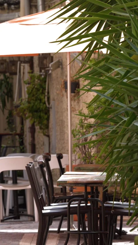 Empty Sidewalk Cafe Seating with Tables and Chairs in Cassis Stock Footage 342582114
