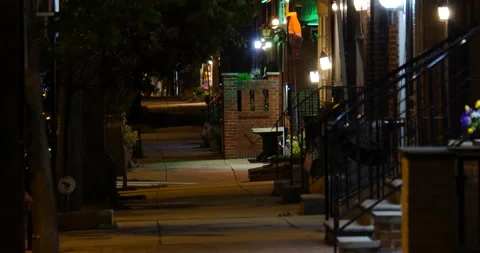 city sidewalk at night