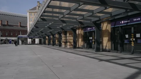 Empty sidewalk outside closed King's cross underground station in London Stock Footage 130319701