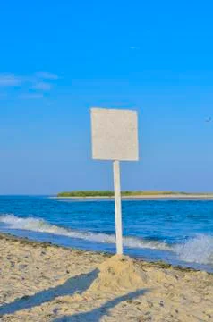 The empty signpost on the seashore Stock Photos