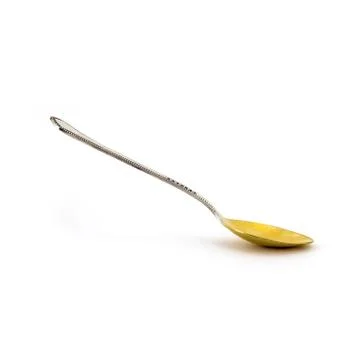 Empty silver desert spoon focus on bowl isolated on white. Foto stock