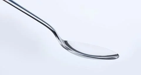 Empty silver spoon Stock Photos