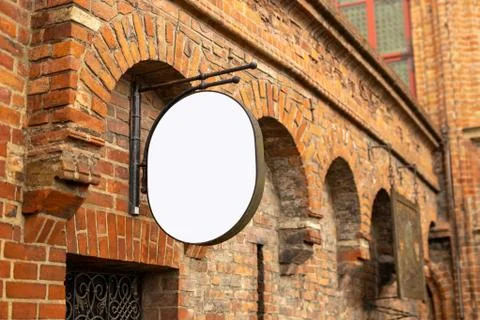 Empty singboard mockup on the wall of old brick building in Gdansk, the beutiful Stock Photos