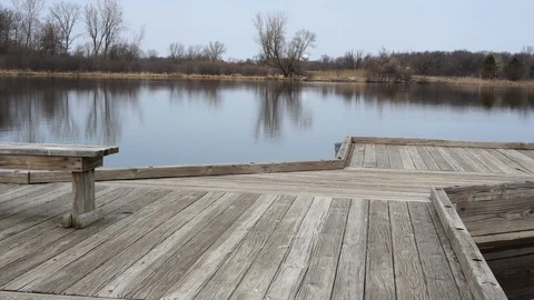 Empty single bench near water lake pier, 4k. Stock Footage 115273173