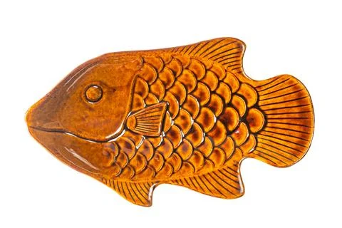 Empty single brown fish shape ceramic plate isolated on white background. Stock-Fotos
