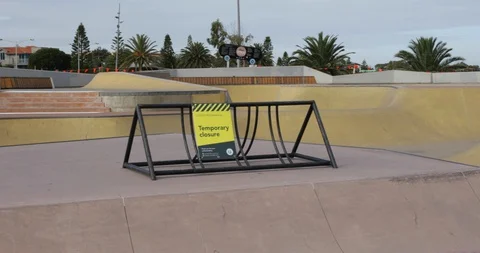 Empty Skate Park with Closure Sign COVID 19 Coronavirus Stock Footage 128939477