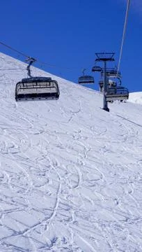 Empty ski cable car at snow mountains Titlis vertical Stock Photos