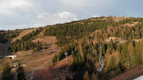 Empty ski-lift chairs in springtime at the sunset Stock Footage 107091089