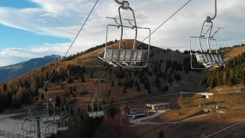 Empty ski-lift chairs in springtime at the sunset Stock Footage 107091123