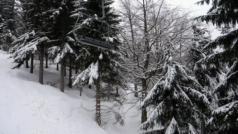 Empty ski lift in forest Stock Footage 86116616