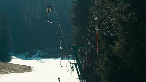 Empty ski lift in the spring. Shot on RED Raven Video stock 105746200