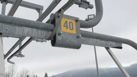 Empty ski lift on a windy day. Closed ski resort due to COVID-19 lockdown. Stock Footage